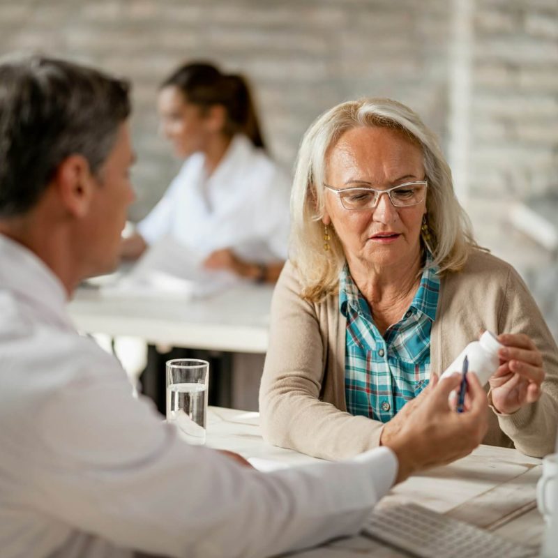 Patient consulting healthcare worker